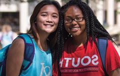 TWo female students in 南 shirts smiling